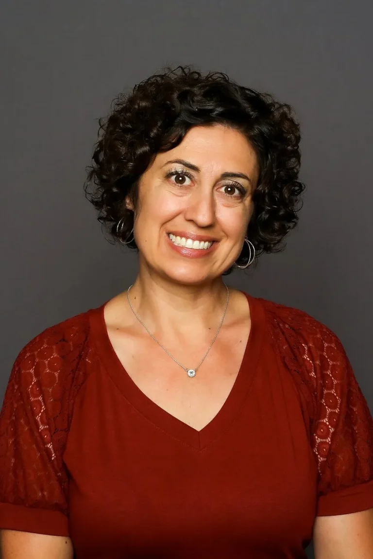 Mrs. Maria Koosman smiling