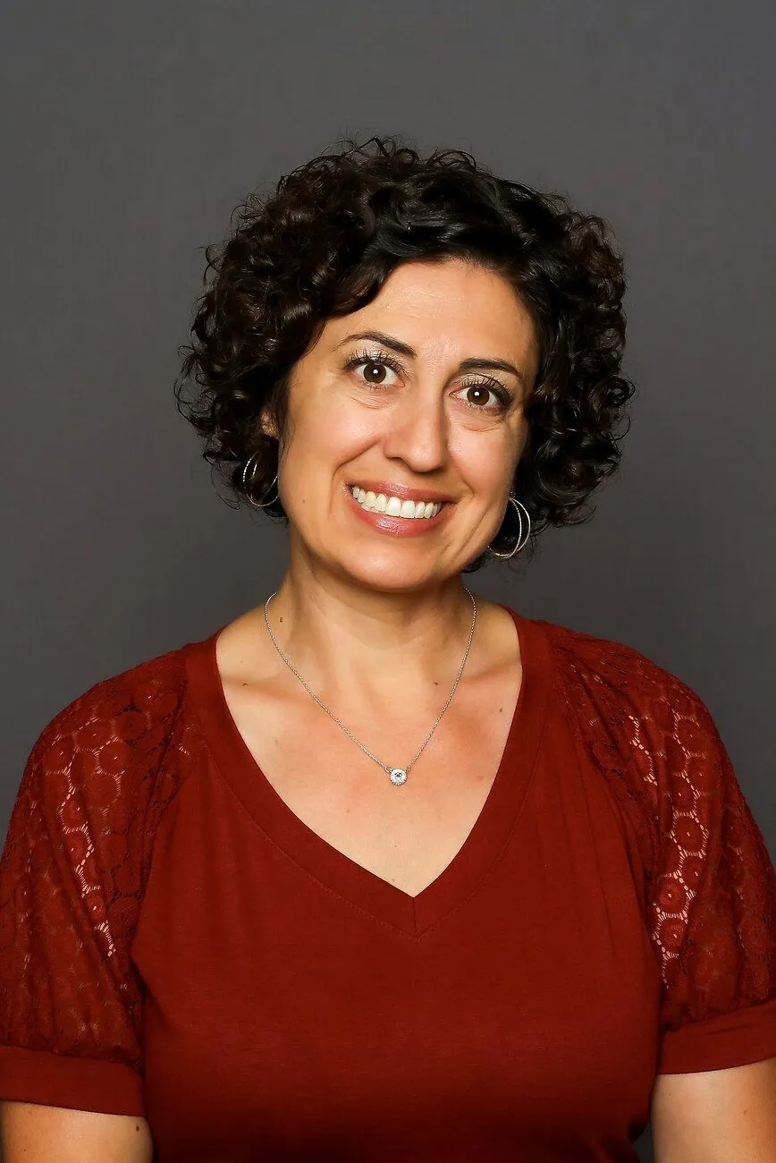 Mrs. Maria Koosman smiling