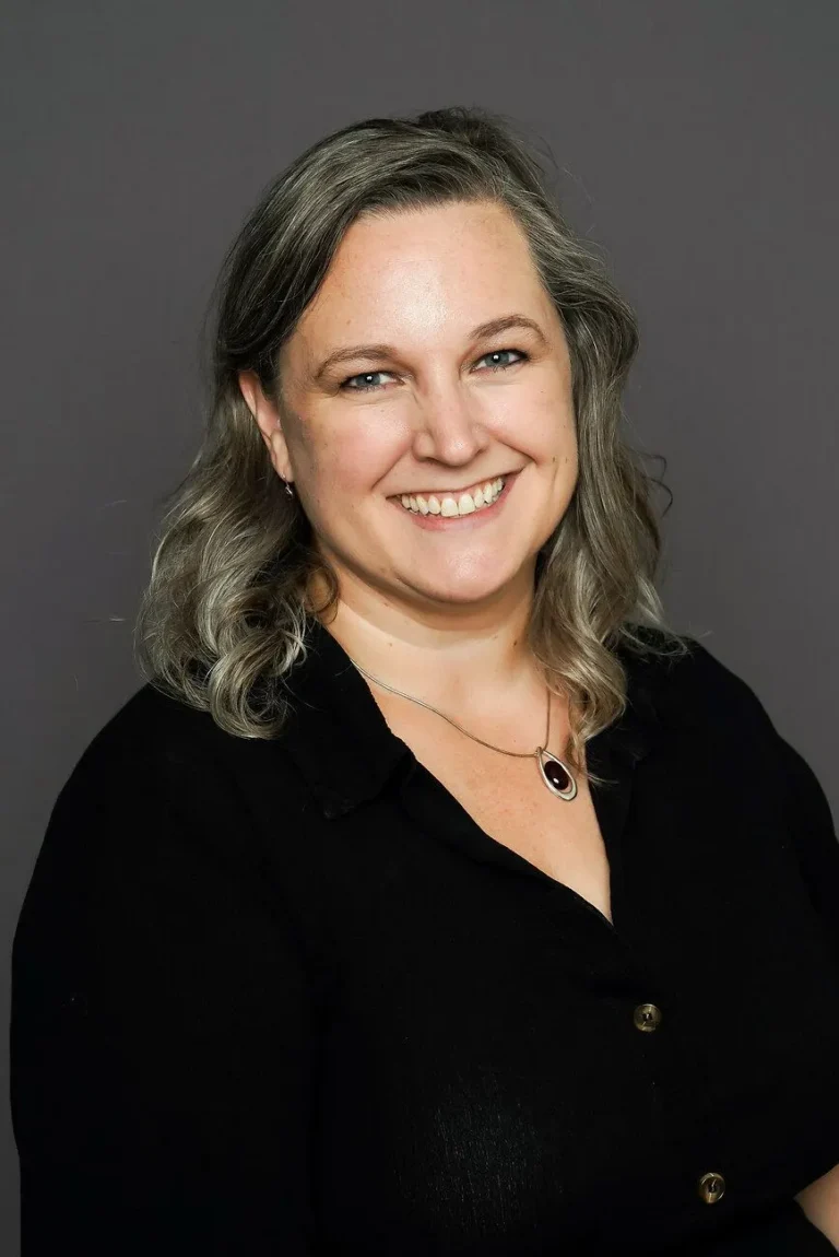 Smiling woman with graying hair